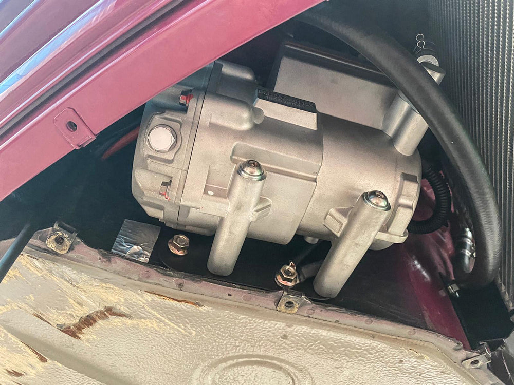 An electric compressor for a car auto air conditioning system